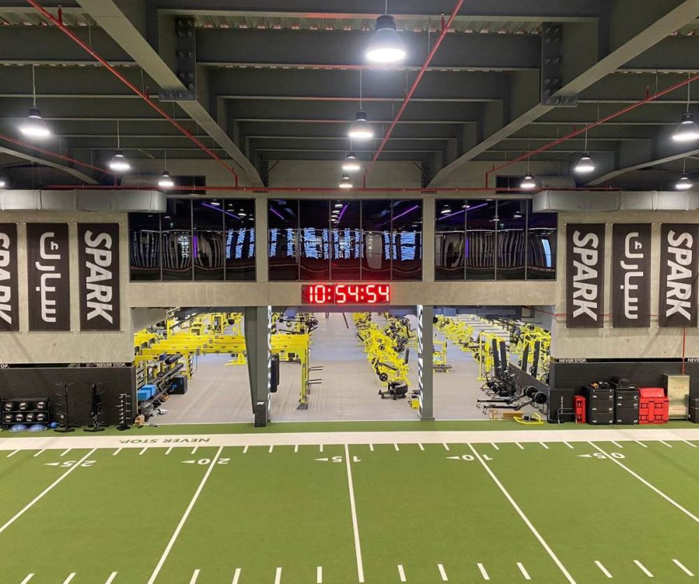 Spark Gym interior in Shuwaikh under its exposed steel roof